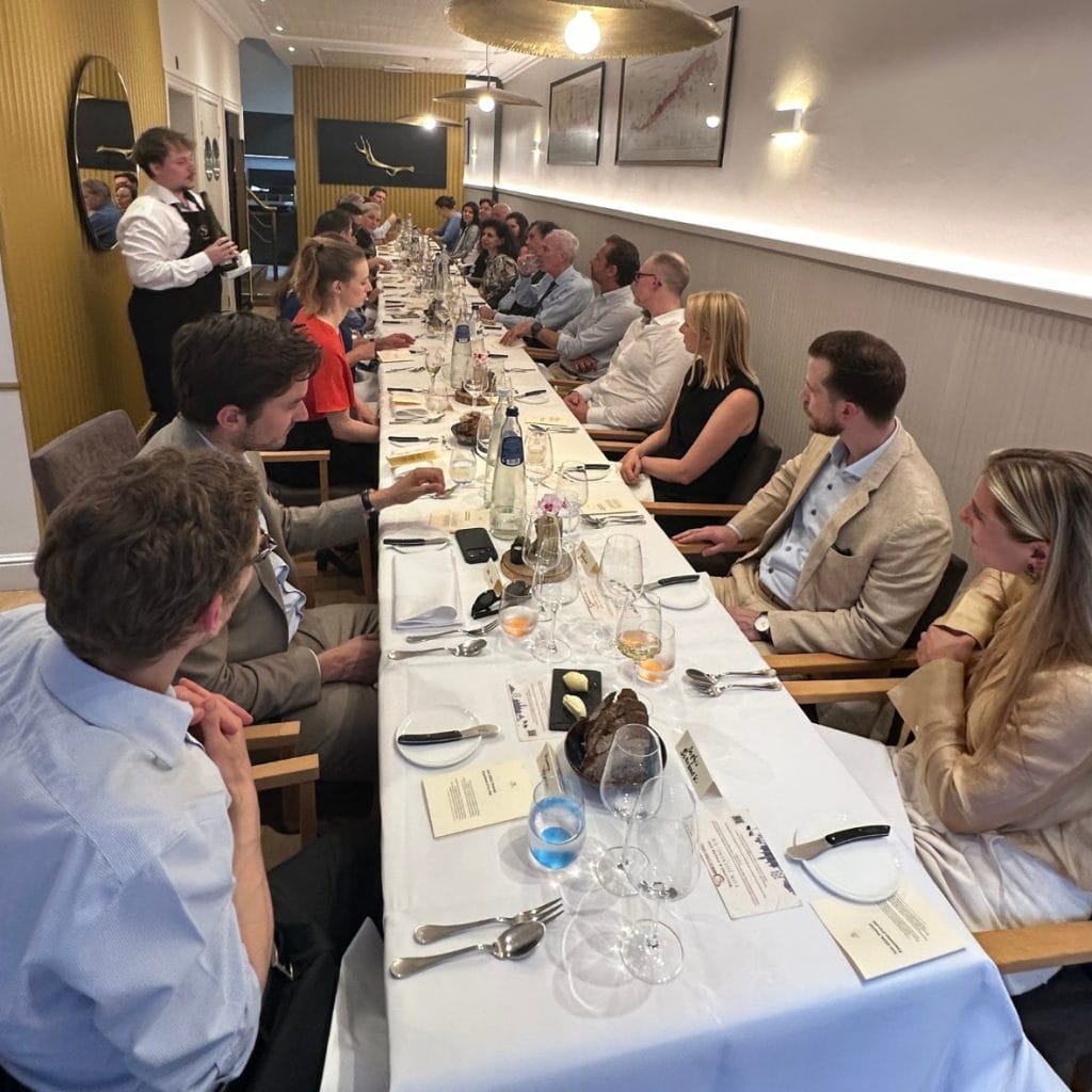 Attendees seated at a WITA International dinner event